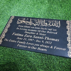 black granite islamic gravestone with golden inscription